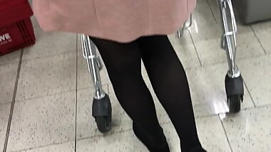 Teen with black pantyhose at Rewe