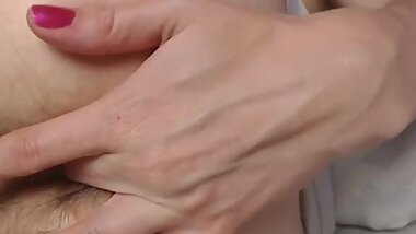 Black toy inside hairy asshole. Close up side view