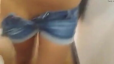 Petite teen jills in changing room and licks fingers clean.