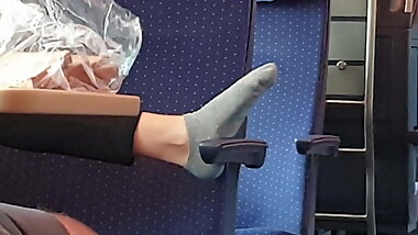 Grey teen socks playing on seat