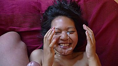 cum cum and more cum into face of a smiling happy cute asian teen