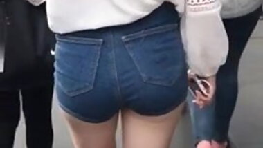 Teen in jeans shorts